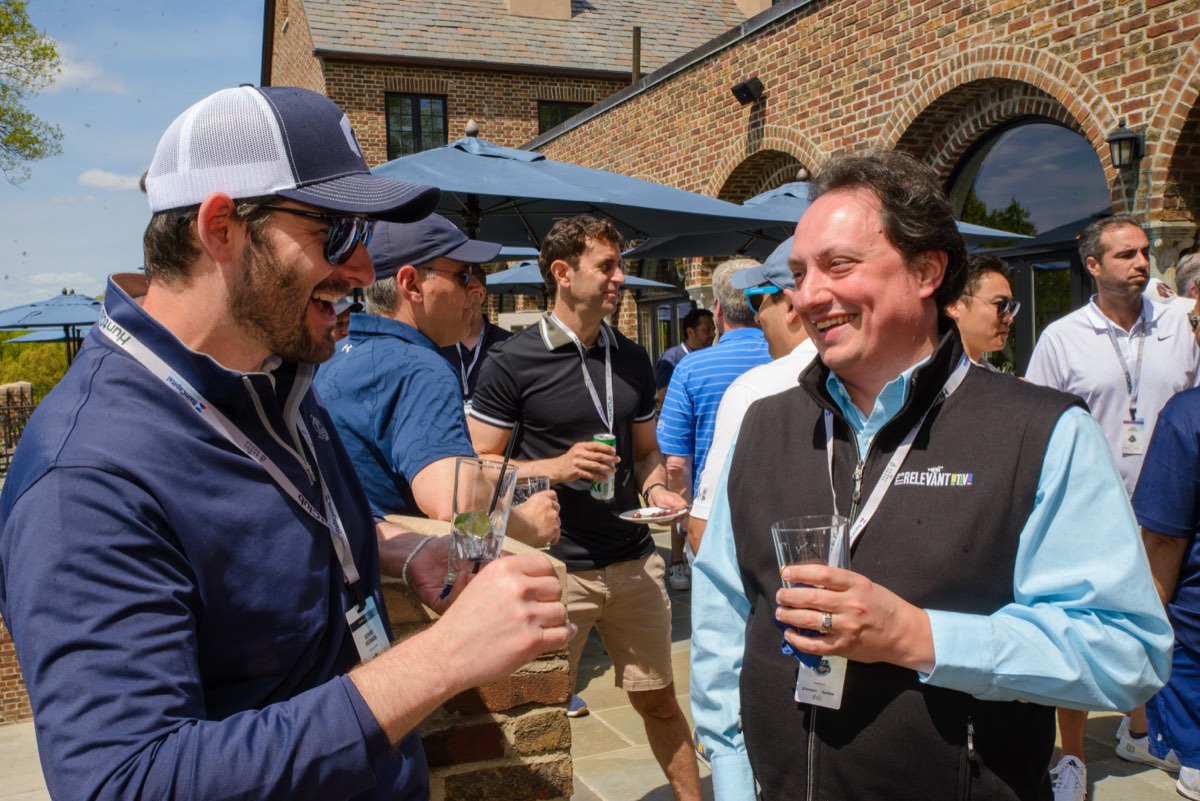 Two players cracking up on the patio