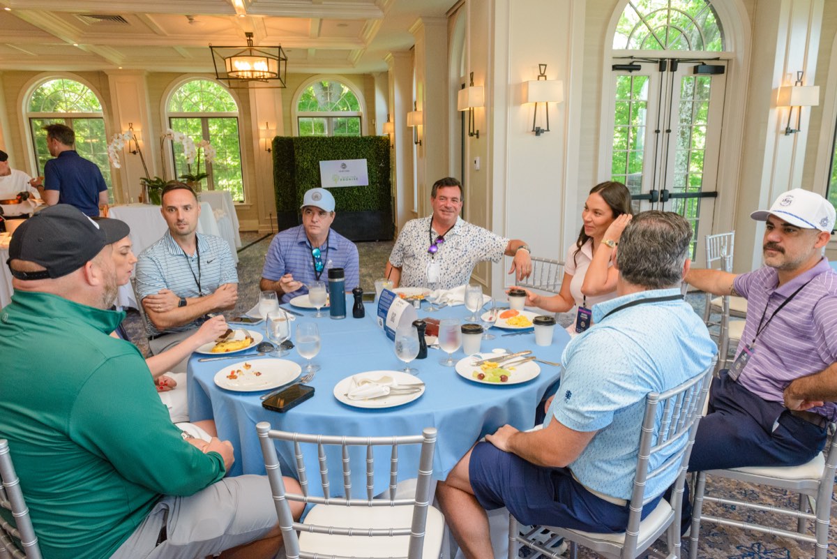 A lunch table of eight, mid-story
